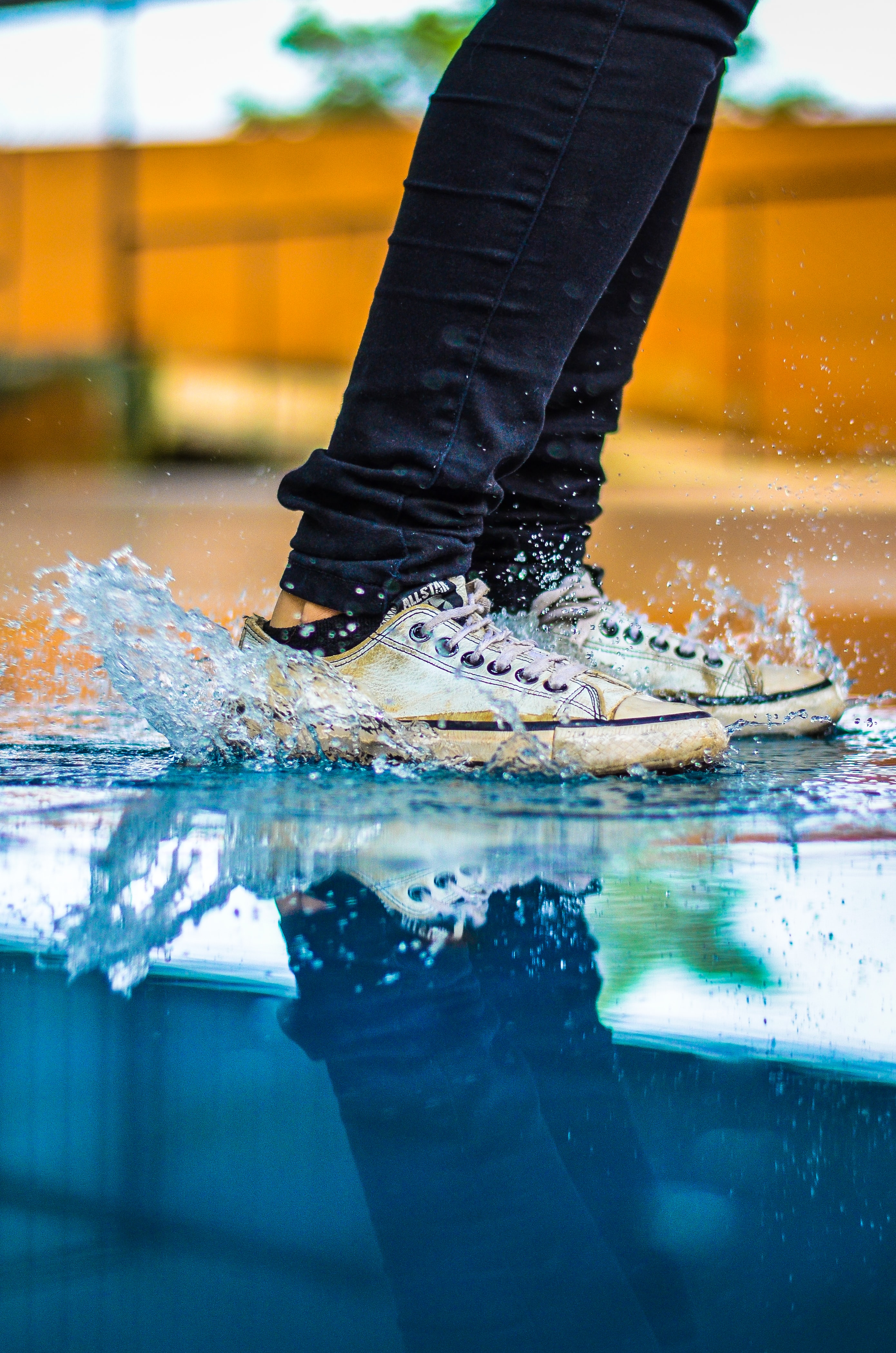 Feet jumping in puddle