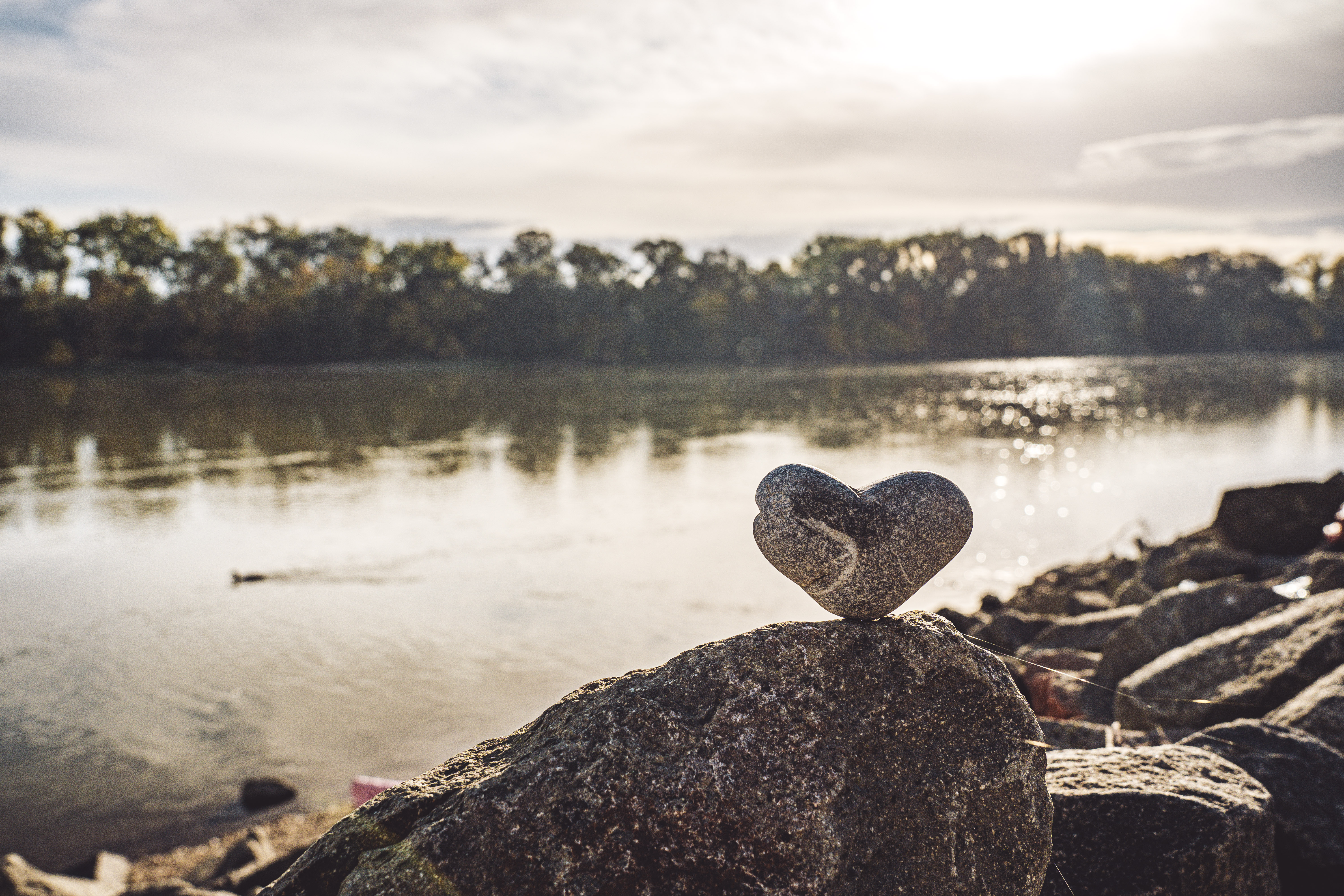 Heart stone in front of the river