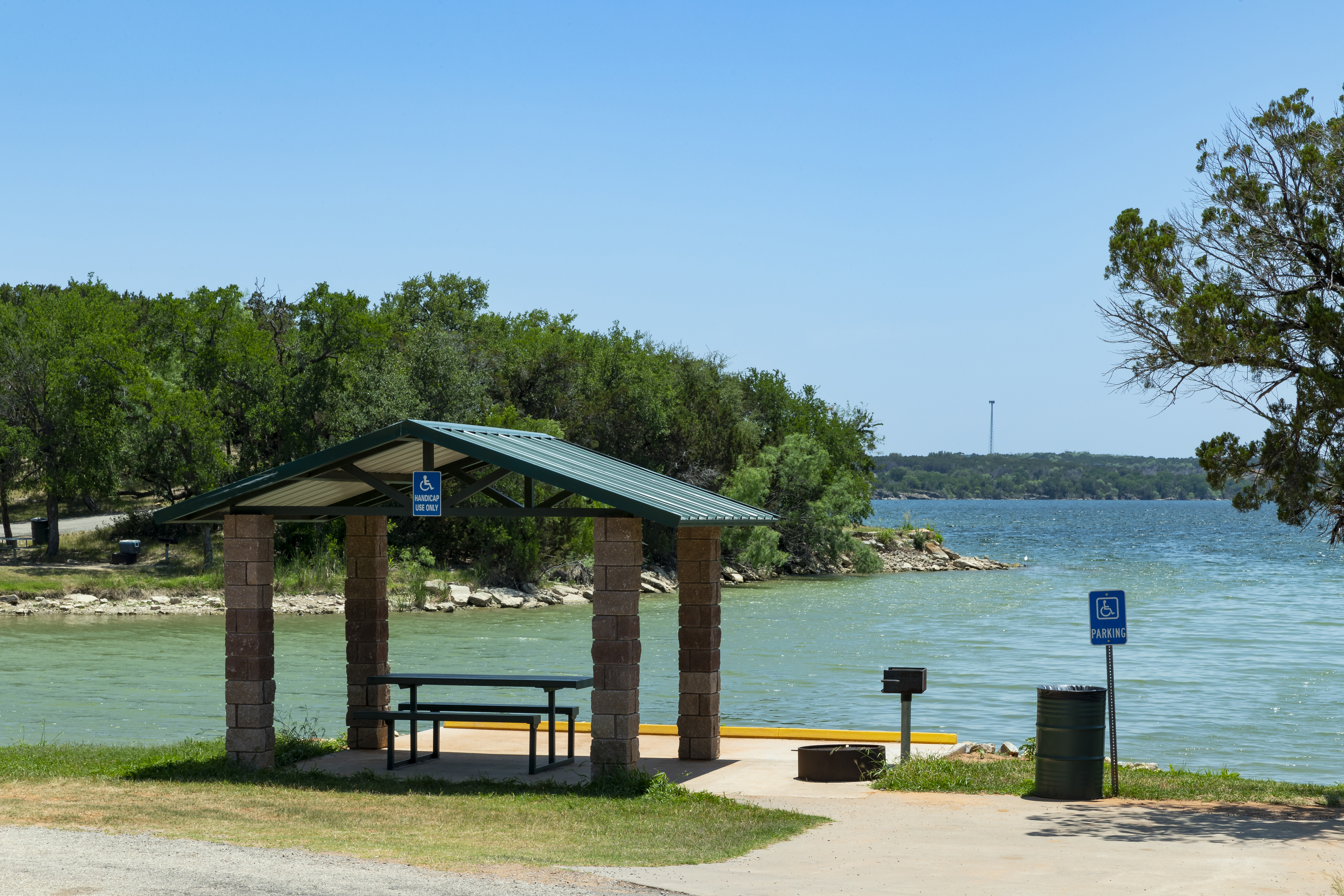 A campground in front of a body of water